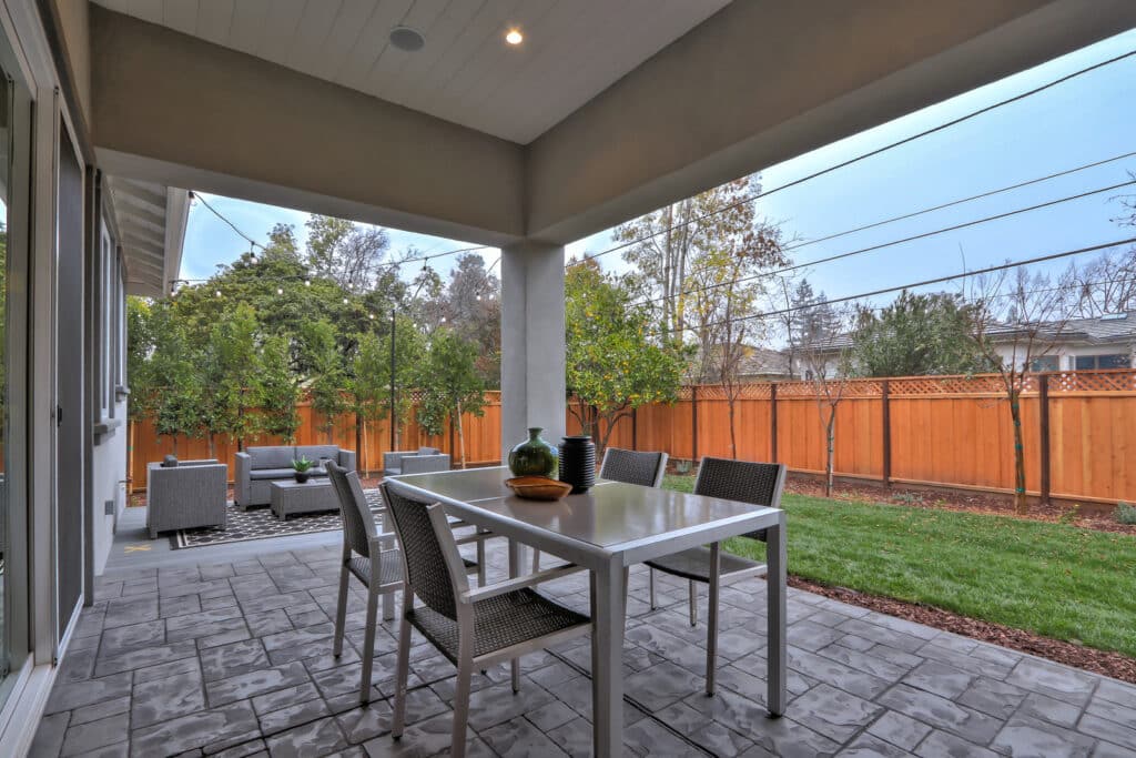 Saratoga backyard view with couch and dining table